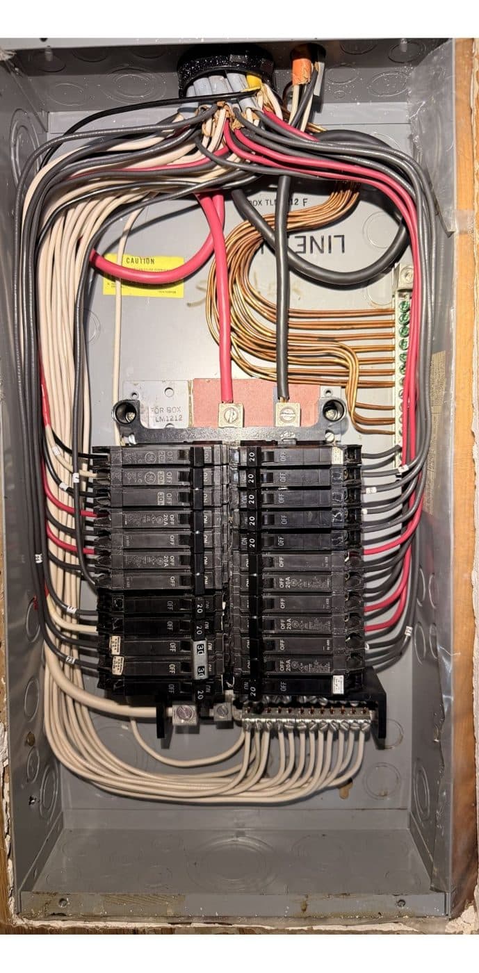 Electrical panel after maintenance — wiring cleaned up and re-terminated